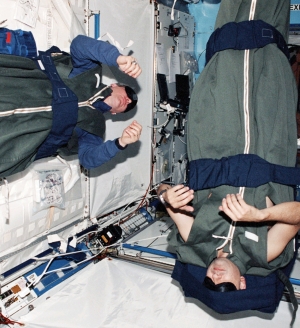 Astronauts Thomas D. Jones and Mark L. Polansky, STS-98 mission specialists, are photographed during their sleep shift in the Destiny laboratory on the International Space Station (ISS). - See more at: http://www.sleepreviewmag.com/2011/10/nasas-sleep-doc/#sthash.KVqsGEEZ.dpuf